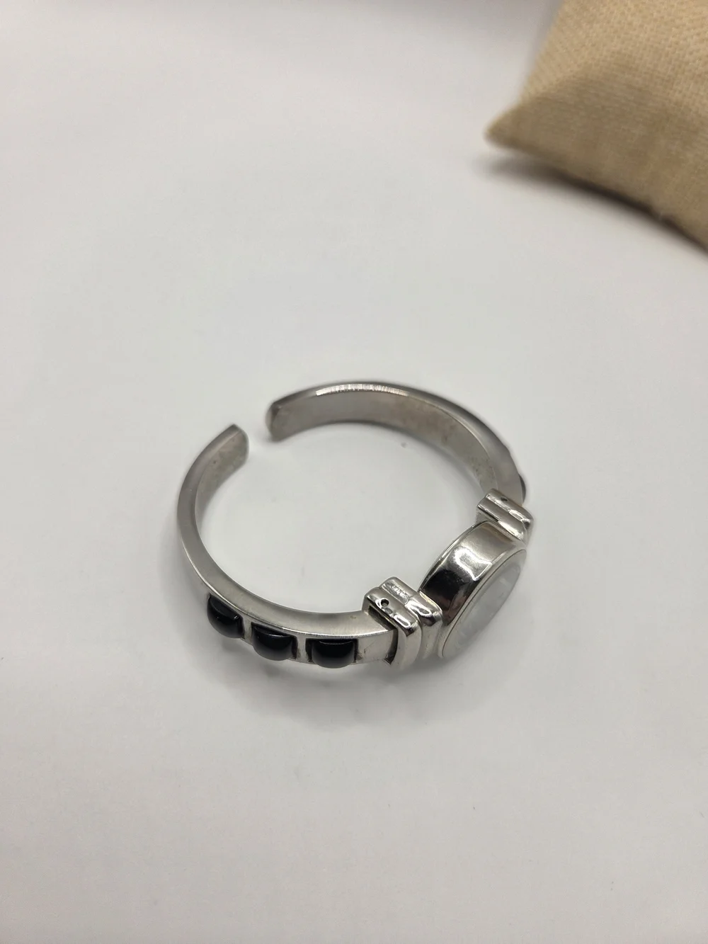 1565. Classic Silver Tone & Black Clamper Bracelet Watch